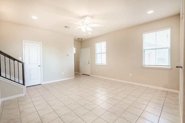 unfurnished room featuring visible vents, a ceiling fan, recessed lighting, stairway, and baseboards