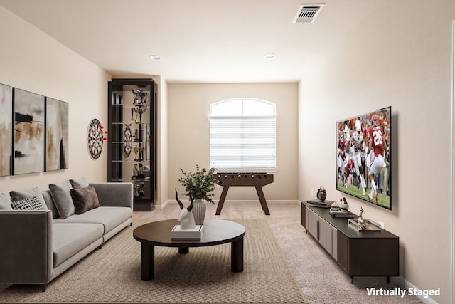 living room with light colored carpet, recessed lighting, baseboards, and visible vents