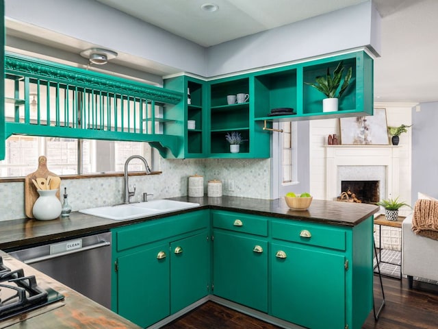 kitchen with dishwasher, open shelves, a fireplace, and a sink