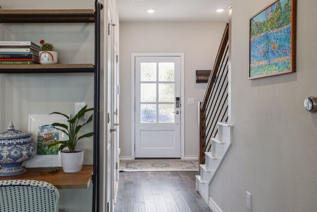 doorway to outside featuring stairway, dark wood finished floors, baseboards, and recessed lighting