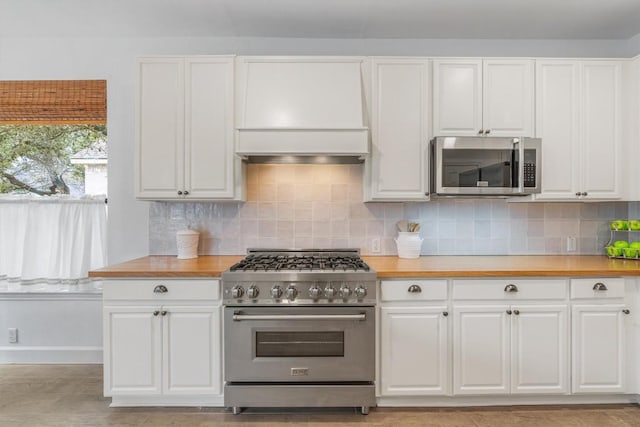 kitchen featuring white cabinetry, tasteful backsplash, and appliances with stainless steel finishes