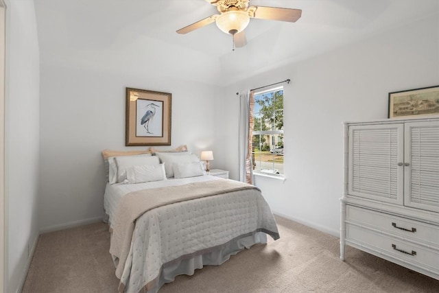 carpeted bedroom featuring a ceiling fan and baseboards