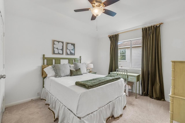 bedroom with light carpet, ceiling fan, and baseboards