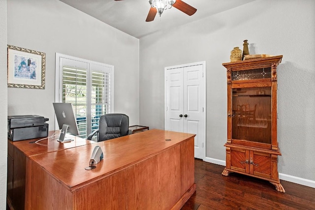 office space featuring dark wood finished floors, a ceiling fan, and baseboards