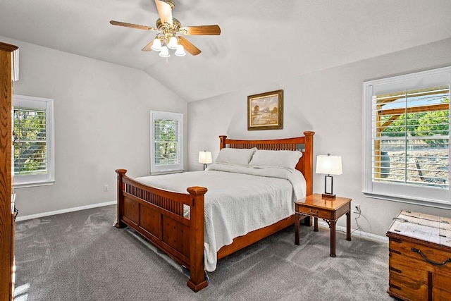 bedroom with carpet, baseboards, vaulted ceiling, and a ceiling fan