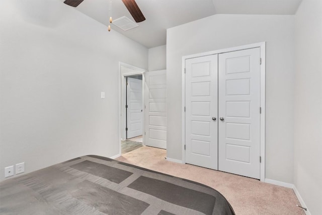 20602 Falcon, Lago Vista, TX 78645 - unfurnished bedroom featuring carpet flooring, a closet, lofted ceiling, and a ceiling fan