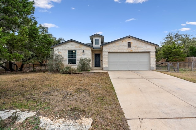 20602 Falcon, Lago Vista, TX 78645 - single story home featuring stone siding, concrete driveway, and an attached garage
