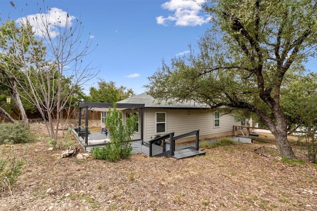 20602 Falcon, Lago Vista, TX 78645 - rear view of property featuring a wooden deck