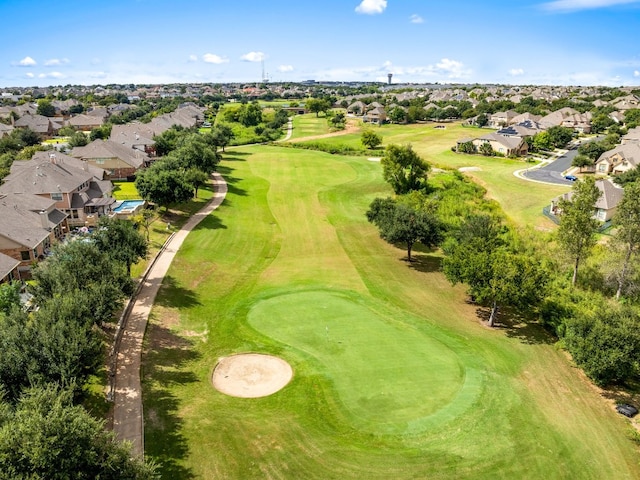 drone / aerial view featuring golf course view and a residential view