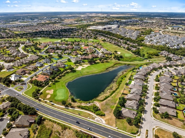 aerial view with a residential view, a water view, and golf course view