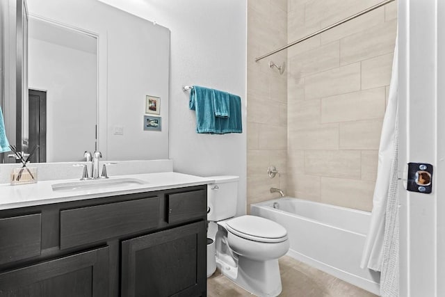 full bath featuring vanity, shower / bath combo with shower curtain, and toilet