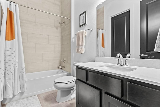 full bath featuring vanity, shower / bath combo with shower curtain, and toilet