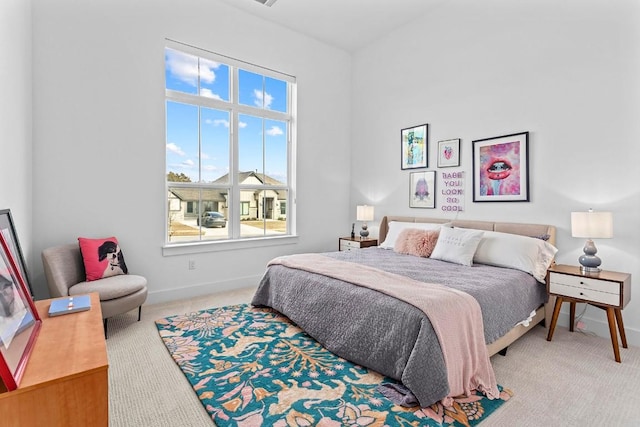 carpeted bedroom featuring baseboards