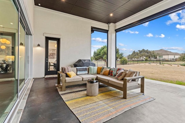 view of patio / terrace with fence and an outdoor living space