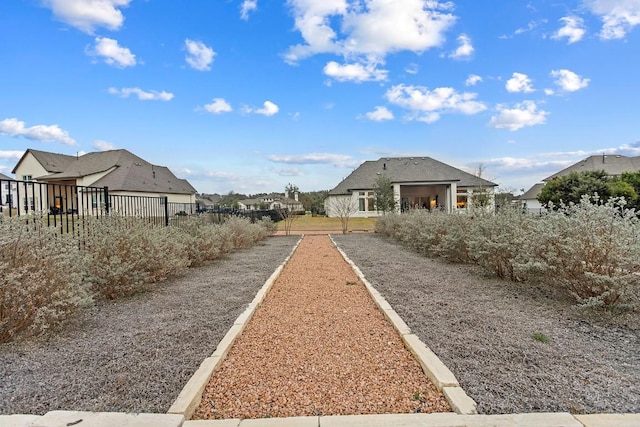 view of community with fence