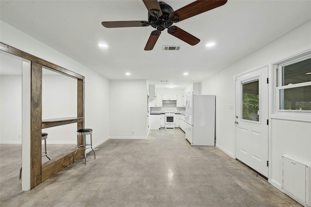 1500 Fairfield Dr, Austin, TX 78757 - unfurnished living room featuring concrete flooring, recessed lighting, baseboards, and a ceiling fan