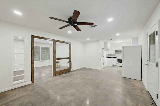 unfurnished living room featuring concrete flooring, recessed lighting, visible vents, and baseboards