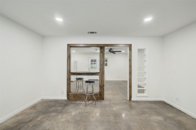 below grade area featuring baseboards, visible vents, and recessed lighting