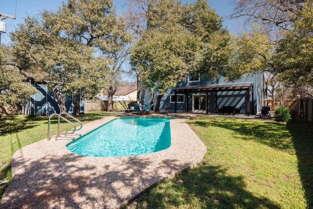 view of pool with a fenced backyard, a fenced in pool, a patio, and a yard