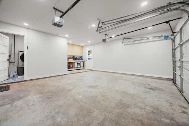 garage with baseboards and a garage door opener