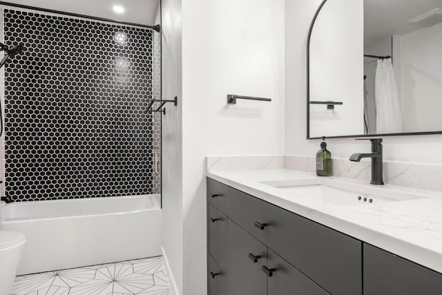 bathroom with toilet, shower / bath combo with shower curtain, and vanity