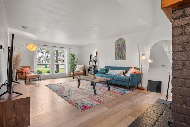 living room featuring wood finished floors and visible vents