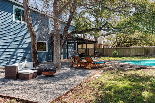 exterior space with a fenced in pool, a patio, fence, a pergola, and a fire pit