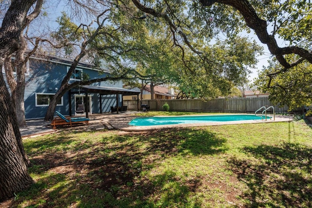 view of pool featuring a fenced backyard, a patio, a fenced in pool, and a yard