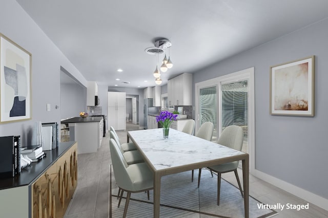 dining room featuring light tile patterned flooring, visible vents, baseboards, and recessed lighting