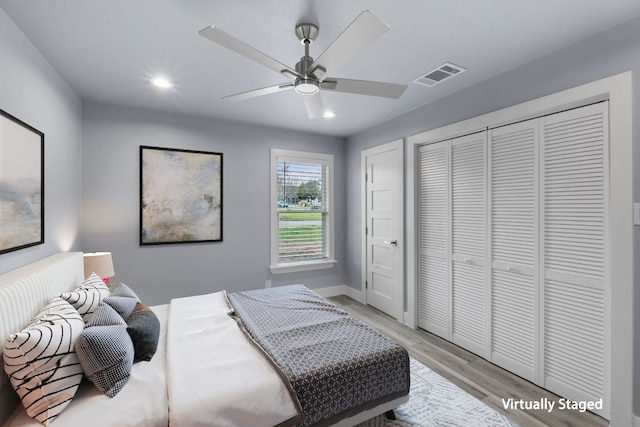 bedroom with light wood-type flooring, visible vents, baseboards, and recessed lighting