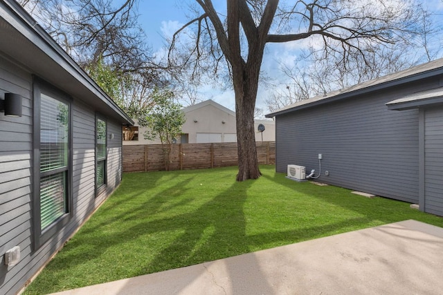 view of yard with ac unit, a patio area, and fence