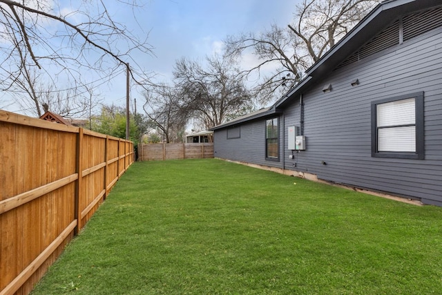 view of yard with a fenced backyard