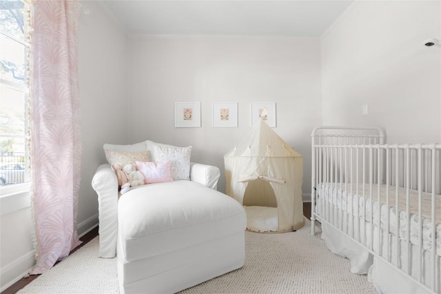 bedroom with baseboards and ornamental molding