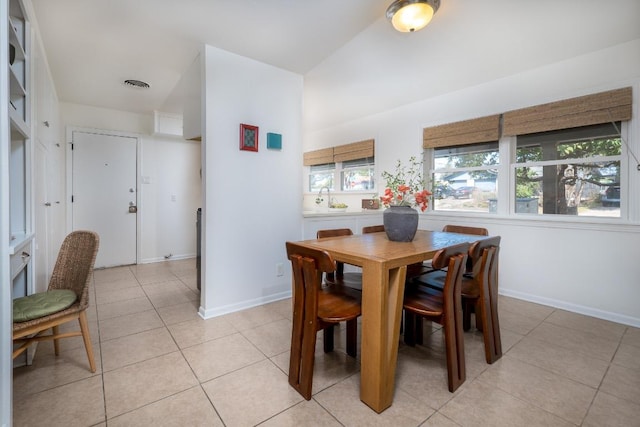 dining space with baseboards, visible vents, and light tile patterned flooring