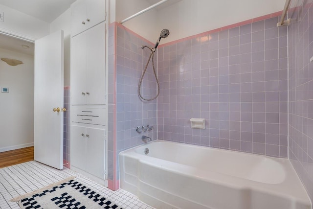 full bathroom featuring bathtub / shower combination and tile patterned floors