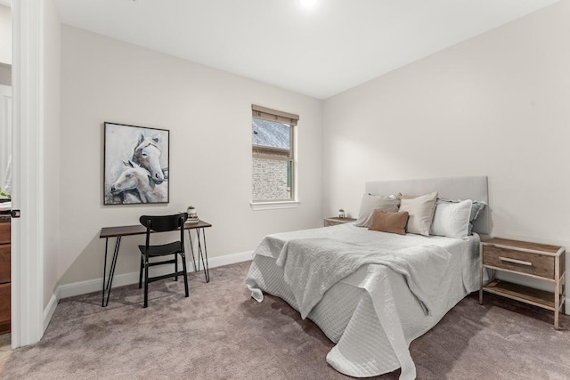 bedroom with carpet and baseboards