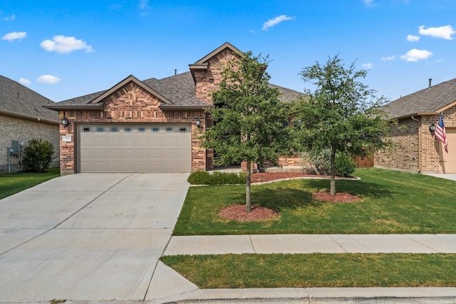 view of front facade with driveway, a garage, a front lawn, and brick siding