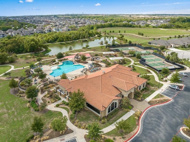 drone / aerial view featuring a water view and a residential view