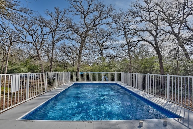 view of pool with fence and a fenced in pool