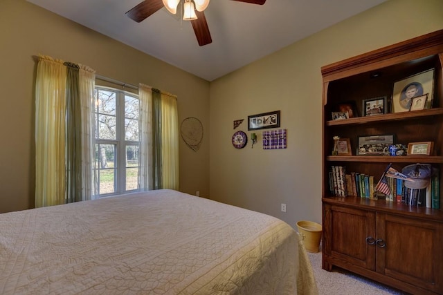 bedroom featuring a ceiling fan and light carpet