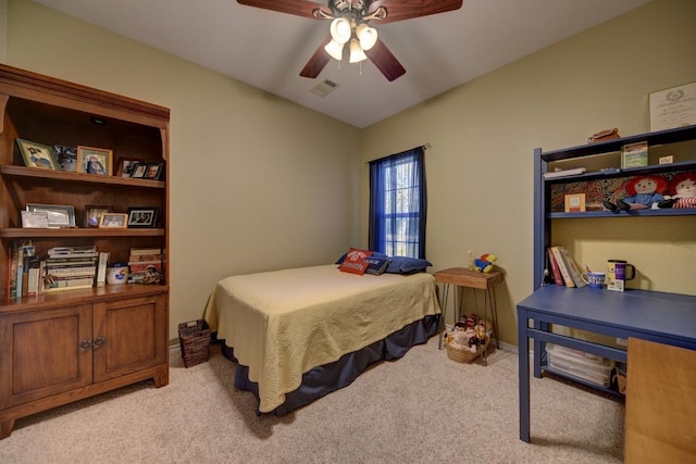 bedroom featuring baseboards, visible vents, a ceiling fan, and light colored carpet