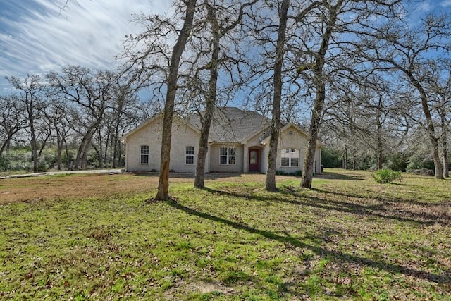 french country home with a front lawn