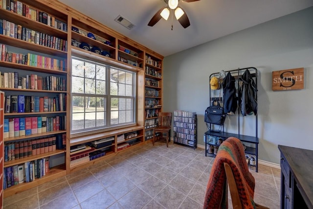 office featuring baseboards, tile patterned flooring, visible vents, and a ceiling fan