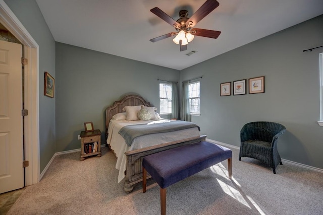 bedroom featuring light carpet, baseboards, and visible vents