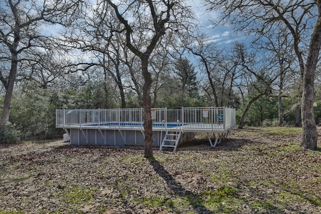 outdoor pool featuring a deck