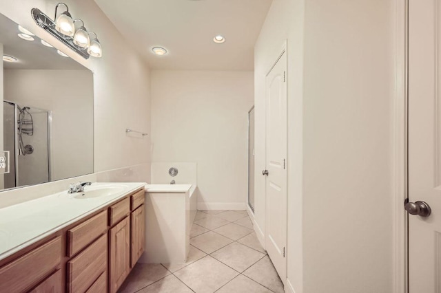 full bath featuring tile patterned flooring, a shower stall, vanity, and a bath