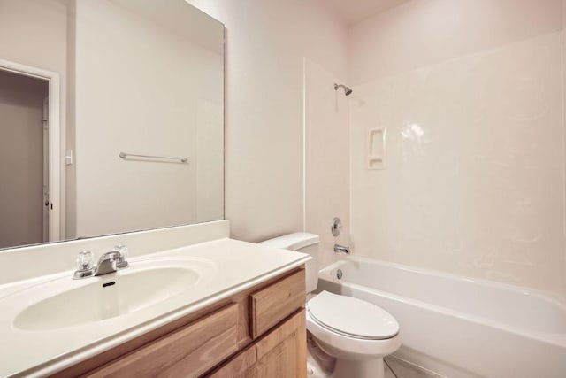 full bathroom with tub / shower combination, vanity, and toilet