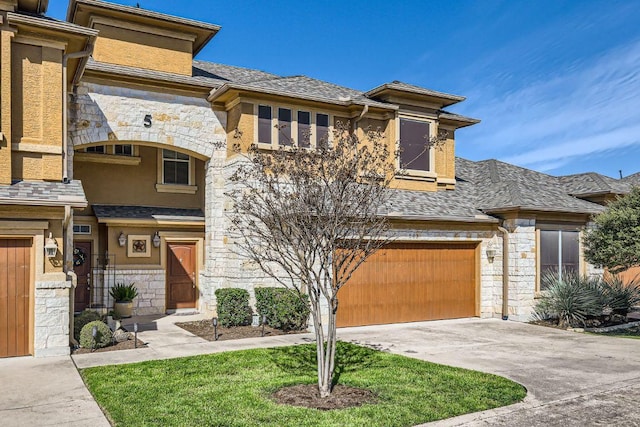 view of front of property with roof with shingles, stucco siding, a garage, stone siding, and driveway