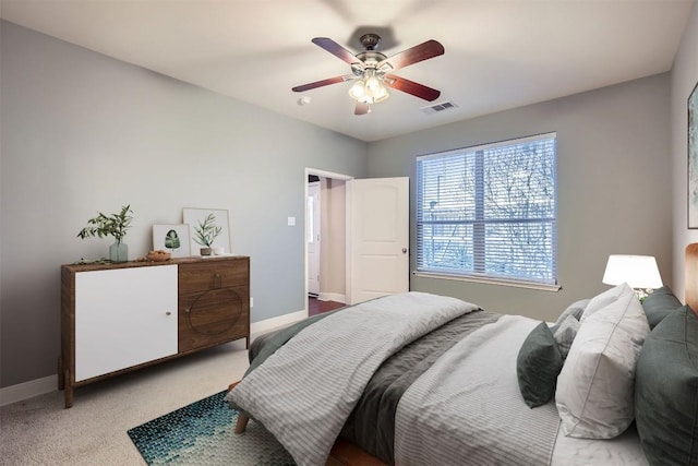 2210 Onion Creek Pkwy Unit 503, Austin, TX 78747 - bedroom featuring baseboards, a ceiling fan, and carpet