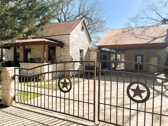 view of gate with a fenced front yard